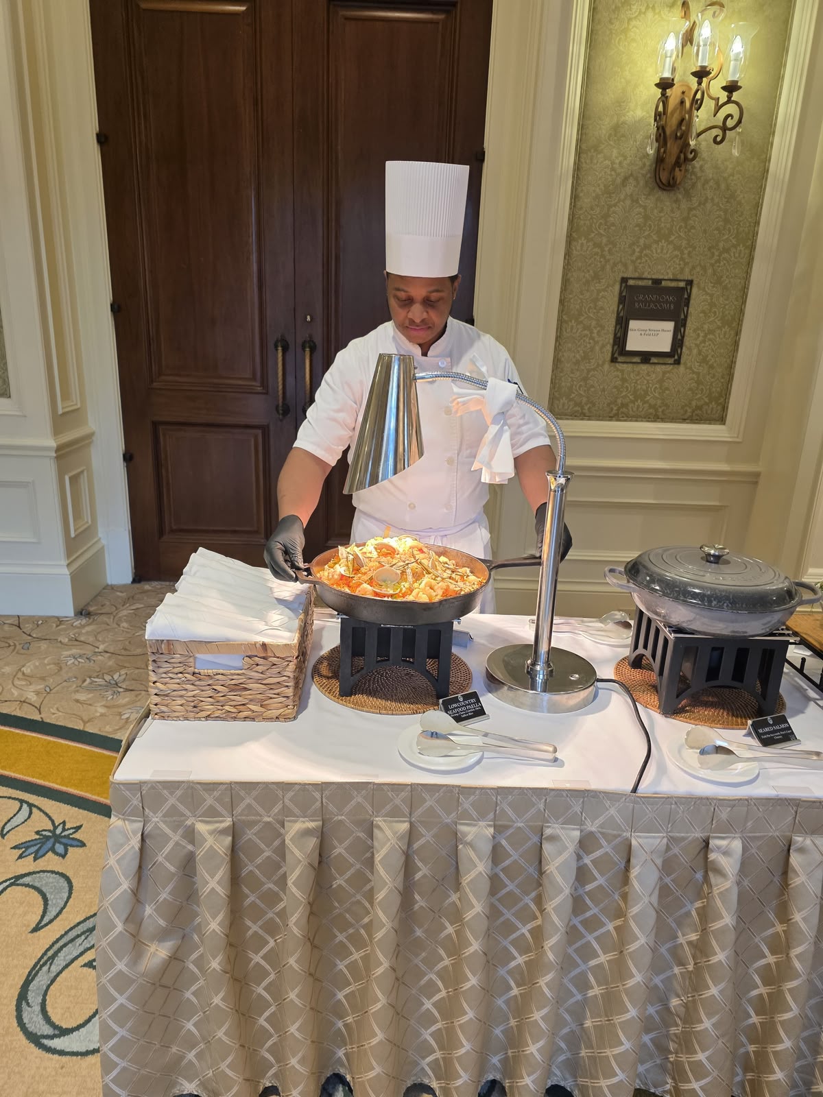 A Polaris participant serving from a chafing station at a US hotel