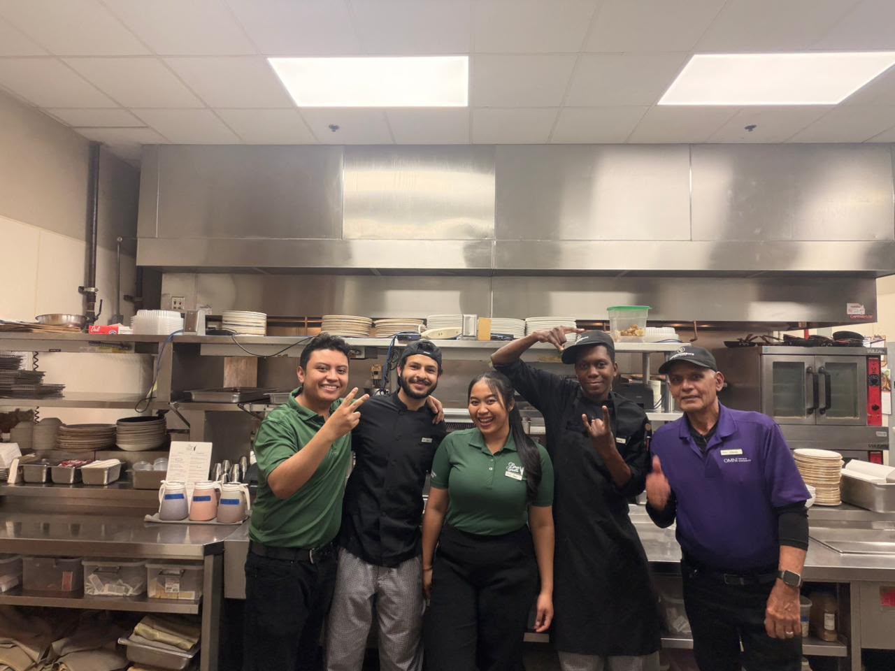 A Polaris participant with the kitchen brigade at a US hotel placement