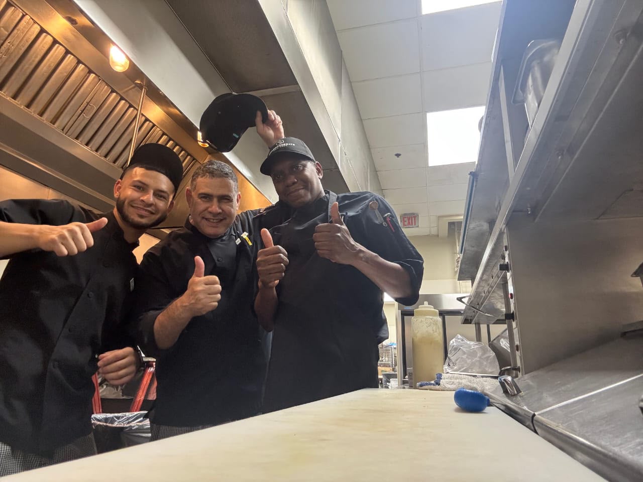 Polaris participants on shift together in a professional US kitchen